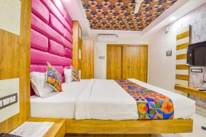Postel nebo postele na pokoji v ubytování FabHotel Signor