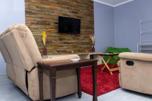 TV a/nebo společenská místnost v ubytování Crystal Homes