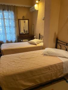 Krevet ili kreveti u jedinici u okviru objekta Olympic Hotel