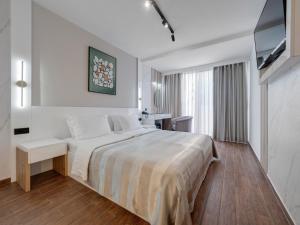 מיטה או מיטות בחדר ב-Hotel Tara Becici