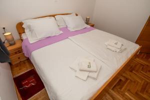 a large bed with white sheets and towels on it at Villa Valencan 1 in Vodnjan +25 photos