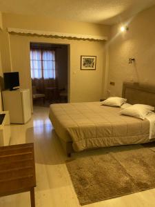 Krevet ili kreveti u jedinici u okviru objekta Olympic Hotel