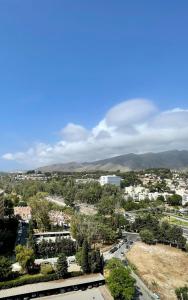 a view of a city with mountains in the background at Top Costa del Sol in Torremolinos
