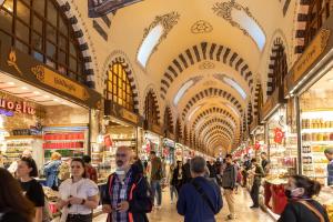 a crowd of people walking through a market with ceilings at Sirin Han Hotel Old City in Istanbul