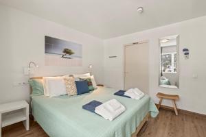Postel nebo postele na pokoji v ubytování Blue Bay Apartments