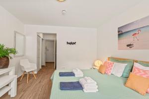 Postel nebo postele na pokoji v ubytování Blue Bay Apartments