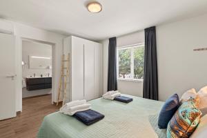 Postel nebo postele na pokoji v ubytování Blue Bay Apartments