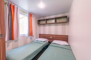 Postel nebo postele na pokoji v ubytování Camping Paradis Val de Coise