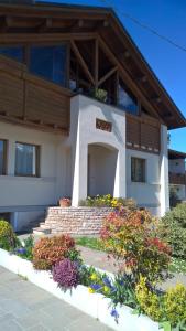 a house with flowers in front of it at B&B San Giorgio in Sovramonte