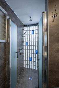 a shower with a glass door in a bathroom at Best Location 3BR Specious Apartment By Vacay in Tel Aviv