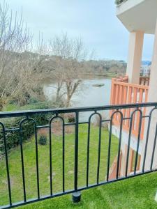 a balcony with a view of a river at Studio port, lac, plage in Talmont