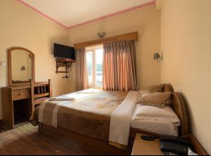 Postelja oz. postelje v sobi nastanitve Green Tara Hotel
