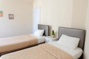 A bed or beds in a room at Cozy apartment in Pangrati area!