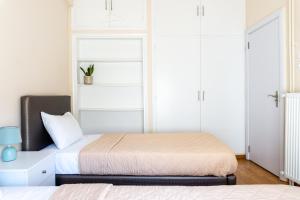 A bed or beds in a room at Cozy apartment in Pangrati area!