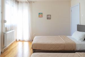 A bed or beds in a room at Cozy apartment in Pangrati area!