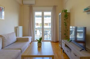 A television and/or entertainment centre at Cozy apartment in Pangrati area!