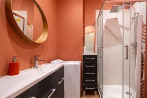 a bathroom with a shower and a sink and a mirror at Les Oiseaux-2 chambres idéalement placé proche plage et centre in Le Touquet-Paris-Plage +26 photos