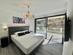 En eller flere senge i et værelse på Fronte di Mare - Grand confort vue mer