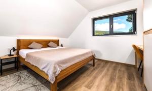 Apartmány Na výsluní Šumava - U lípy客房内的一张或多张床位