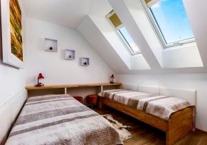 Apartmány Na výsluní Šumava - U lípy客房内的一张或多张床位