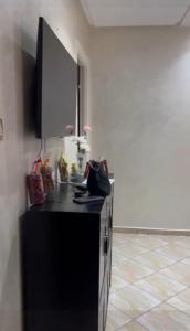 a kitchen with a black counter top in a room at plateau appartement safi in Safi +3 photos
