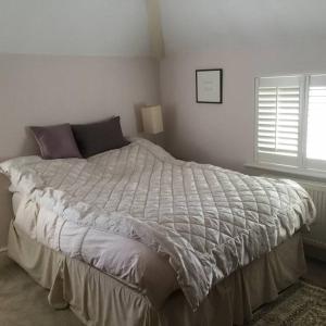 Voodi või voodid majutusasutuse Victorian cottage - single occupancy toas