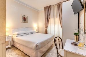 Postel nebo postele na pokoji v ubytování Hotel Orazia