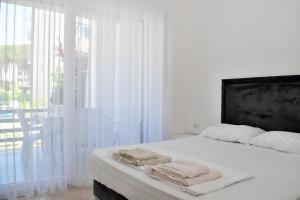 Ένα ή περισσότερα κρεβάτια σε δωμάτιο στο Sunny Beach Apartments - 126