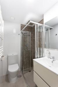 a bathroom with a toilet and a sink and a shower at Calpe Beach in Calpe