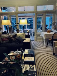 a living room with a couch and a table at The Laindons in Hastings