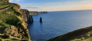 a rock formation in the middle of the ocean at Coastal Hideaway Pod in Fisherstreet