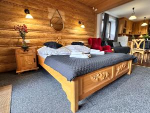 Posteľ alebo postele v izbe v ubytovaní Apartamenty z widokiem na Tatry Cztery Pory Roku