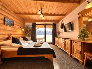 Posteľ alebo postele v izbe v ubytovaní Apartamenty z widokiem na Tatry Cztery Pory Roku