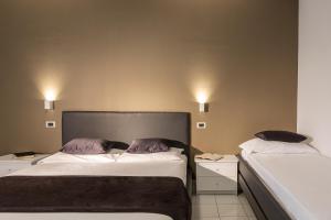 Posteľ alebo postele v izbe v ubytovaní Hotel Mediterraneo Ombrellone e Lettini Inclusi