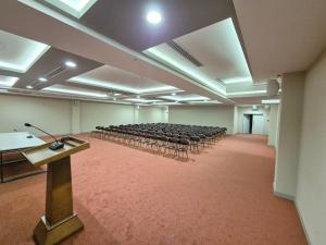 a large room with chairs and a podium in it at Arena Hotel Goranboy in Goranboy +25 photos