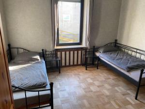 Ένα ή περισσότερα κρεβάτια σε δωμάτιο στο Wohnsol Apartments und Gästezimmer