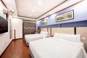 Postel nebo postele na pokoji v ubytování A25 Hotel - 53 Tuệ Tĩnh