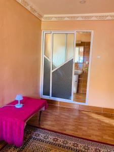A bed or beds in a room at Gite Tawada