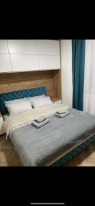 Postel nebo postele na pokoji v ubytování Pink Apartmani