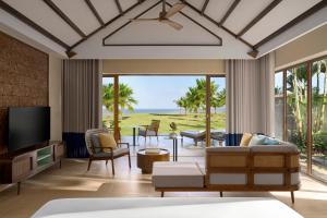 a living room with a view of the ocean at voco Quang Binh Resort by IHG in Dong Hoi