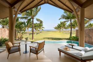 a villa with a view of the golf course at voco Quang Binh Resort by IHG in Dong Hoi
