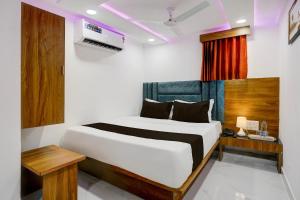 Ένα ή περισσότερα κρεβάτια σε δωμάτιο στο Super Hotel O Rion Inn