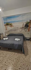 Postel nebo postele na pokoji v ubytování Nettuno Rooms