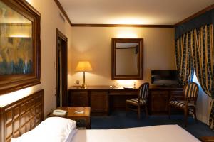 Posteľ alebo postele v izbe v ubytovaní Grand Hotel Trento