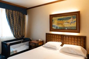 Posteľ alebo postele v izbe v ubytovaní Grand Hotel Trento