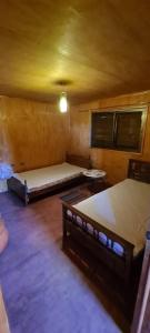 Postel nebo postele na pokoji v ubytování Cómoda cabaña rodeada de naturaleza