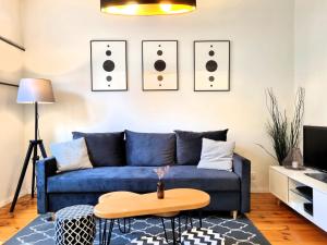 Televízia a/alebo spoločenská miestnosť v ubytovaní Apartament Dwa Lwy Gdańsk Stare Miasto