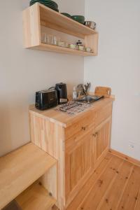 a kitchen with a wooden counter with a sink at Applehill in Istanbul