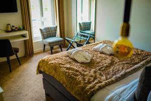 Postel nebo postele na pokoji v ubytování Hôtel-Restaurant Bel Ami