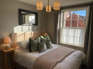 Ένα ή περισσότερα κρεβάτια σε δωμάτιο στο Seascape Cottage